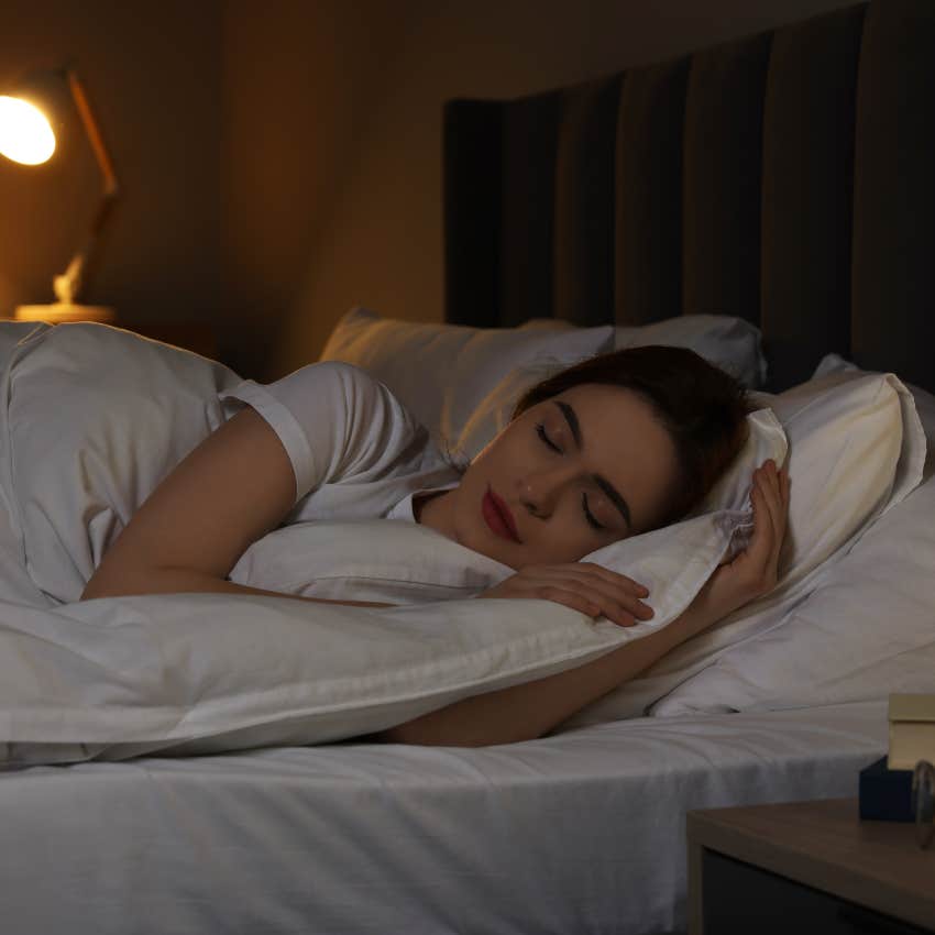 woman in bed prioritizing sleep after a long work day