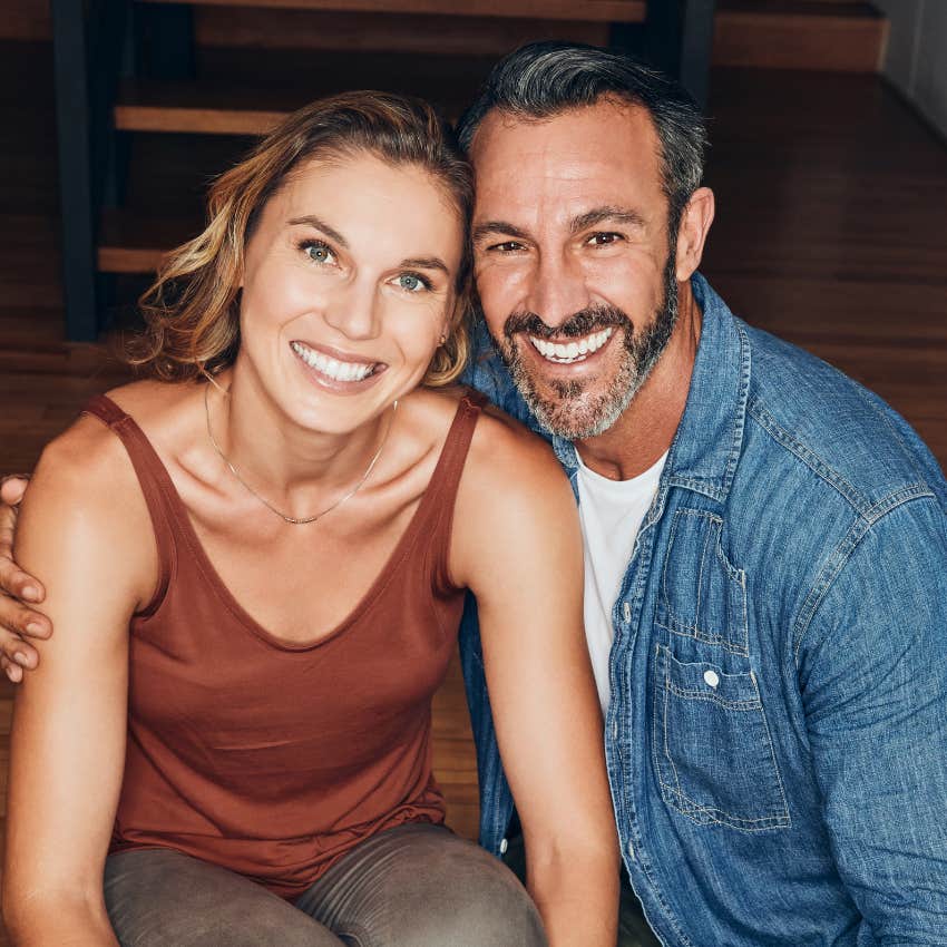 couple smiling uses law of delayed actions to get through hard times and stay together