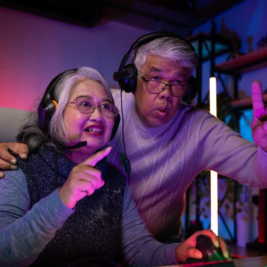 happy couple playing video games learning to work together as a team
