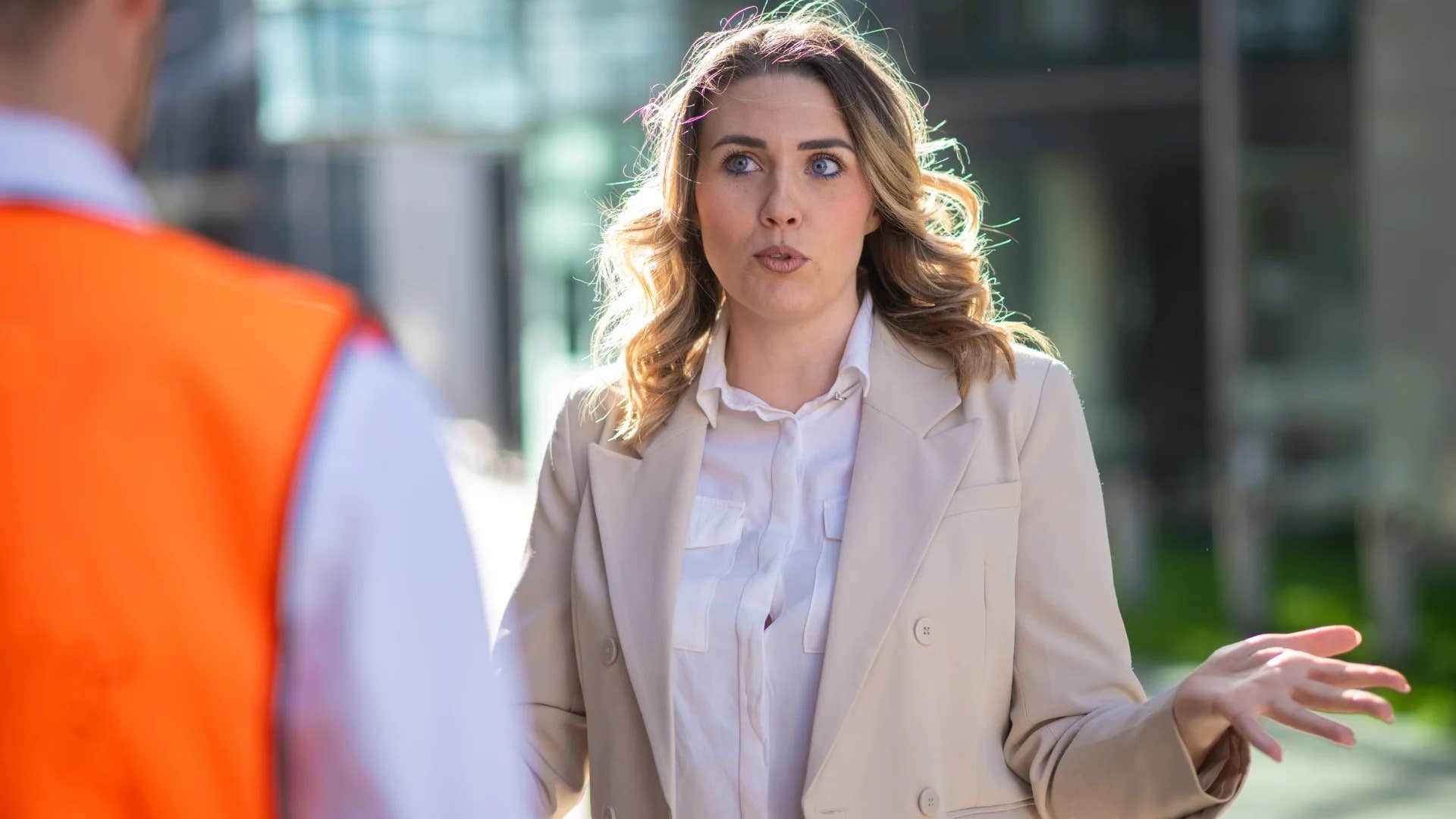 middle aged woman struggling with authority figures in public