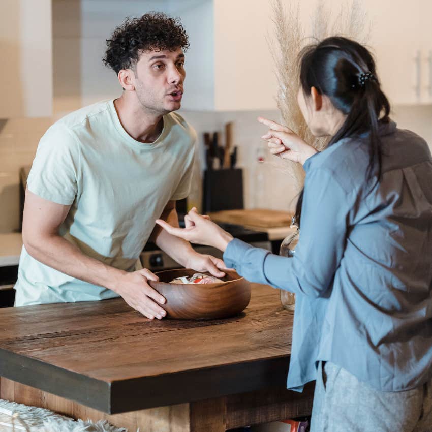 angry man yelling at wife rudely saying it's my house