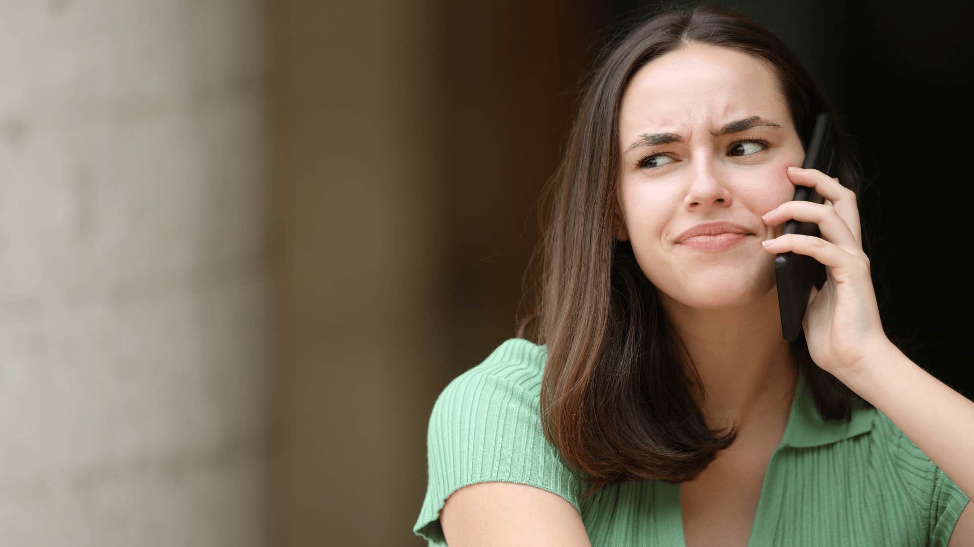 woman on the phone annoyed as she thinks it's hard for me to click with people