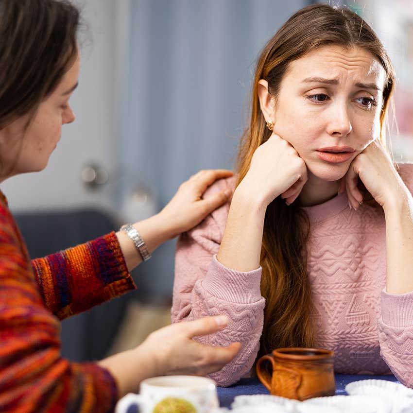 woman comforting upset friend validating her