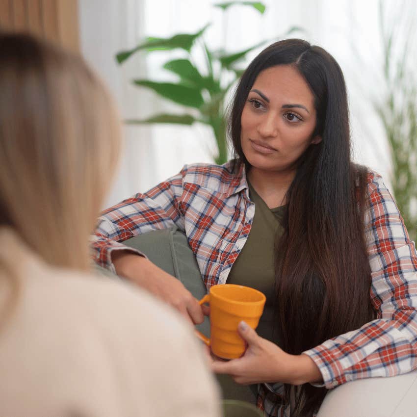 serious woman getting the apology she deserves