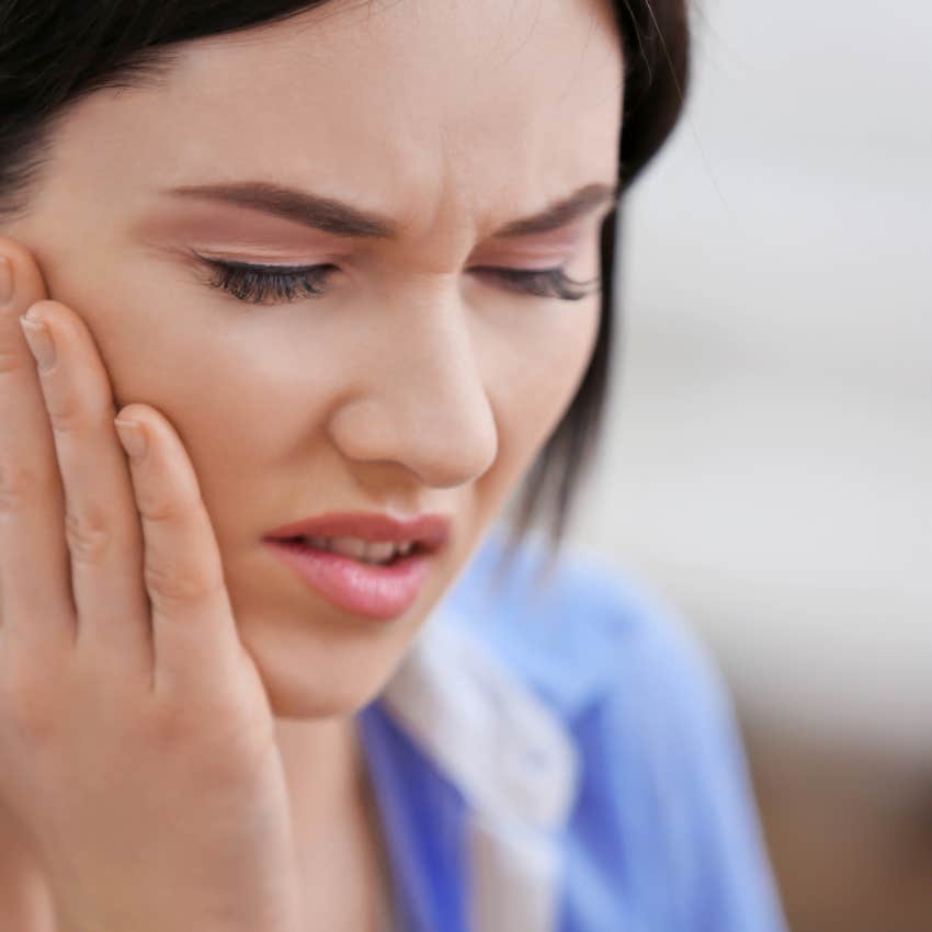 woman who's body is rejecting the life she's living clenching her jaw