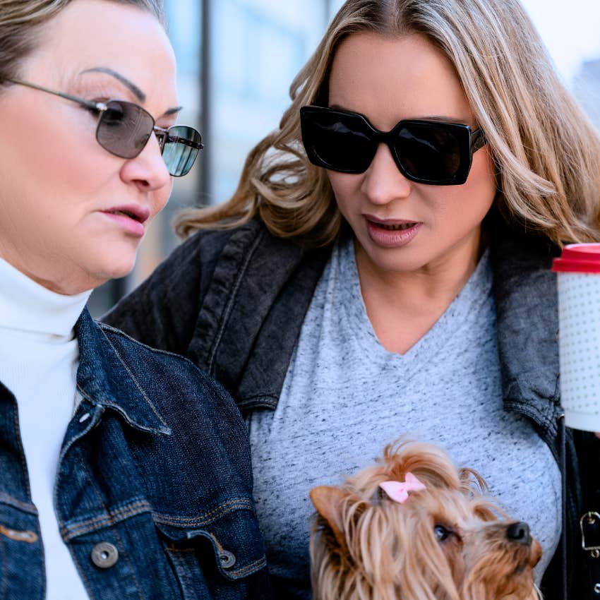 small-minded woman cruelly telling friend you're embarrassing yourself