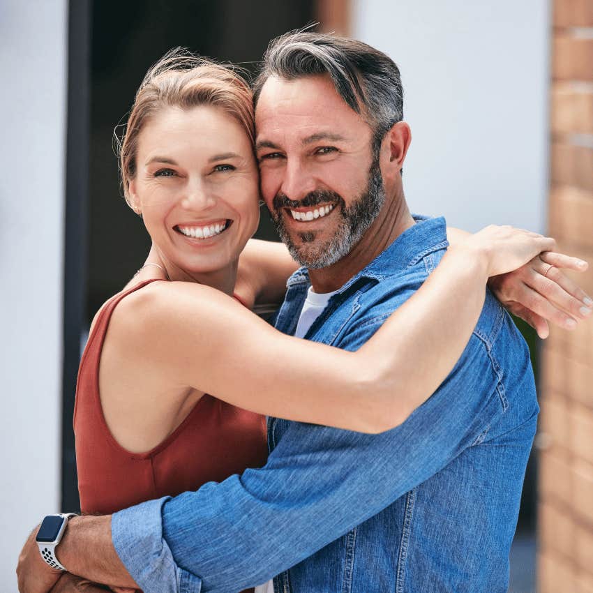 smiling loving couple hugging