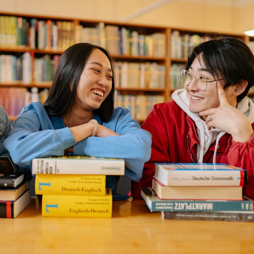 friends in the library talking with one about to leave
