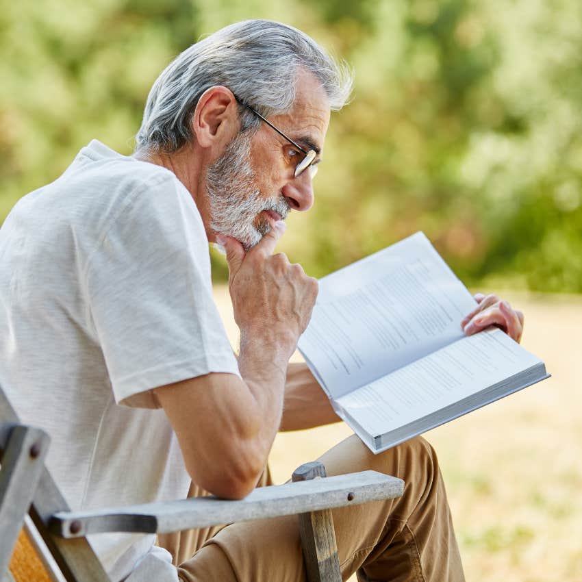 older man reading a book
