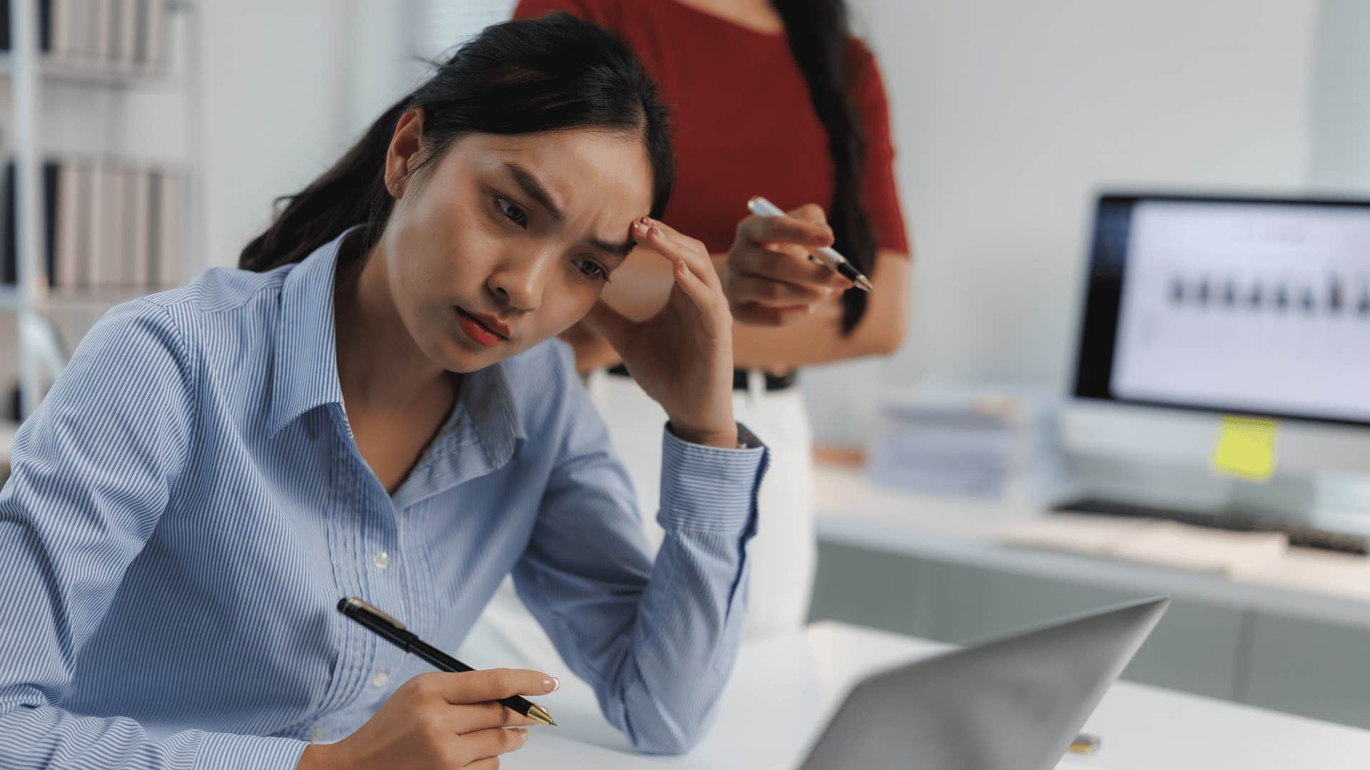 sad woman feeling upset over narcissistic colleague
