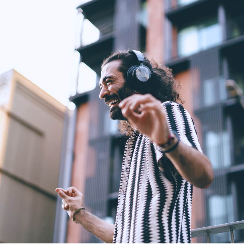 High-value man trying things they're bad at and dancing outside.