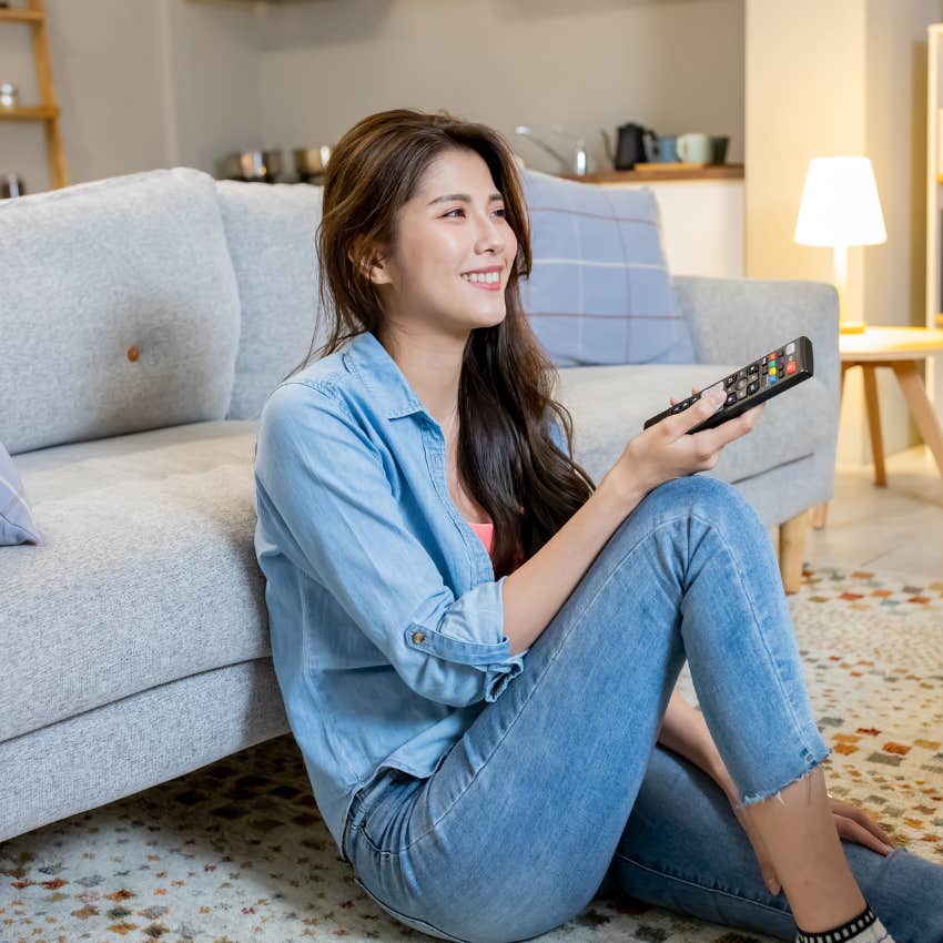 gen z woman flipping through streaming services 