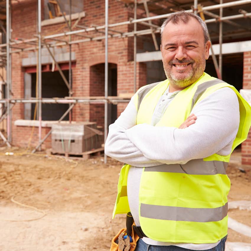 Gen X construction worker happily doing manual labor