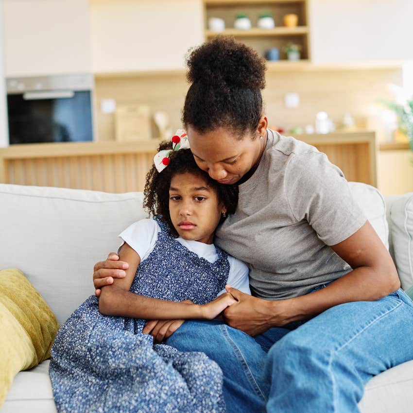 mom hugging upset daughter telling her that her feelings are valid