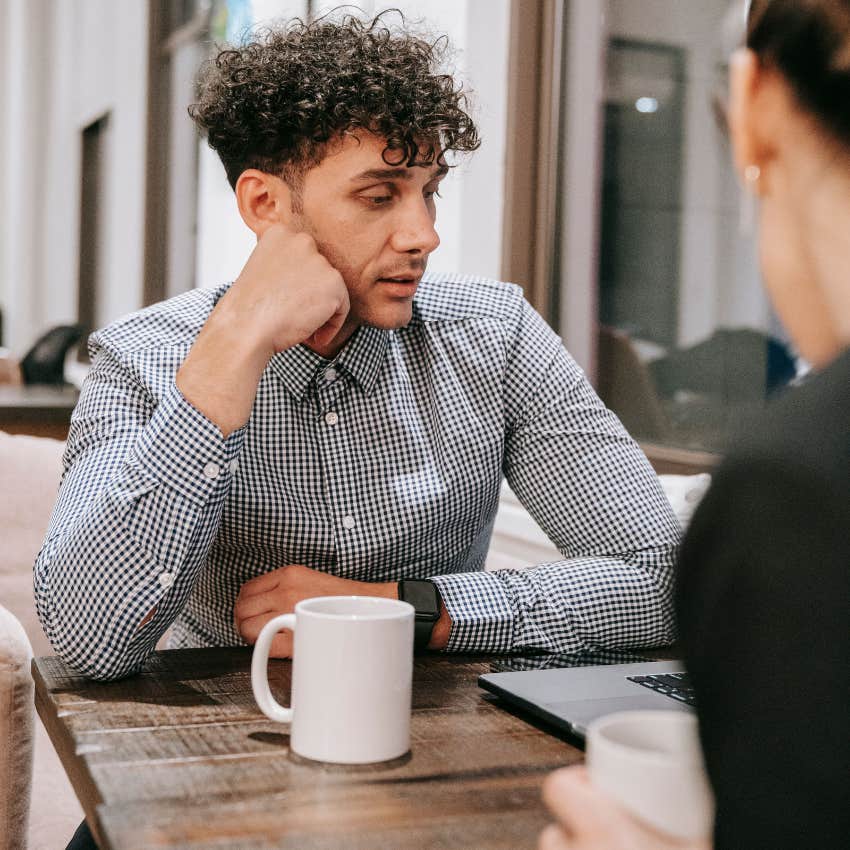 introverted man feeling drained from socializing with friend