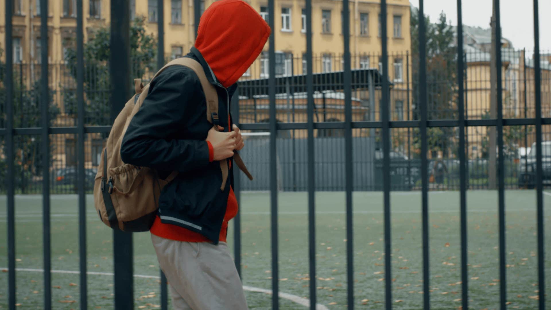 kid with red hoodie staying outside until the streetlights came on