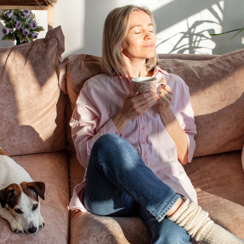 highly sensitive woman feeling joy during alone time while having a cup of tea