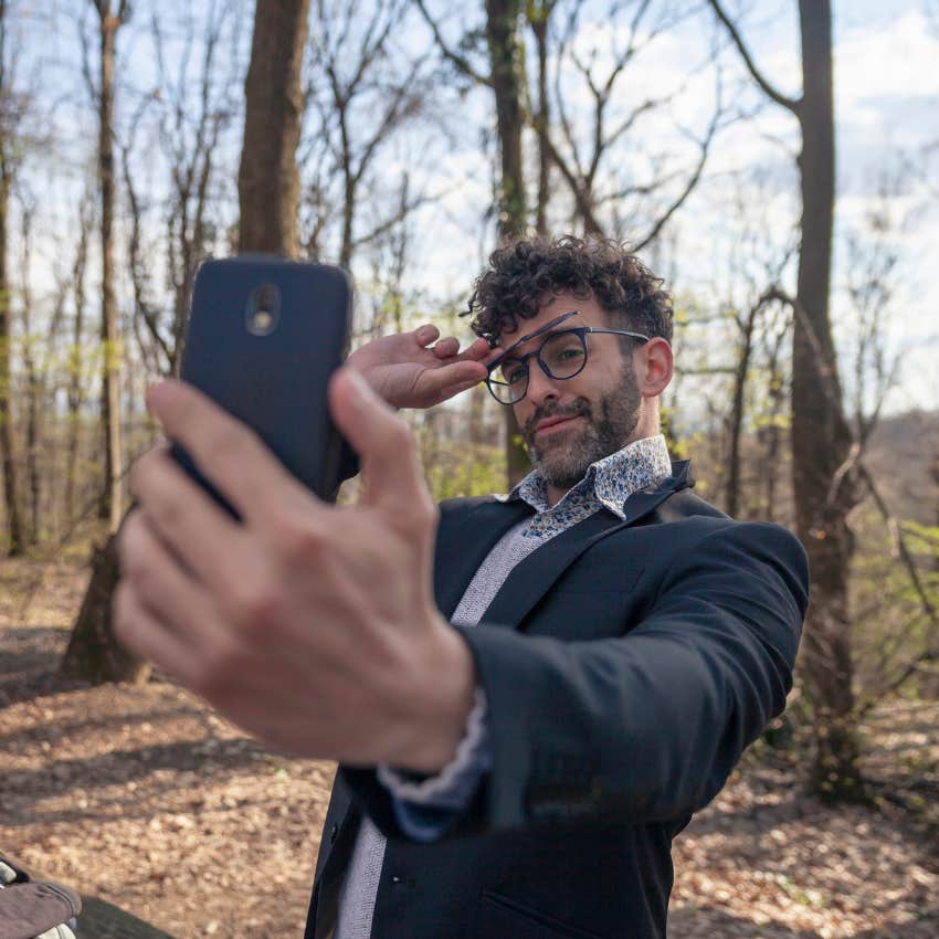 man posting things on social media for attention
