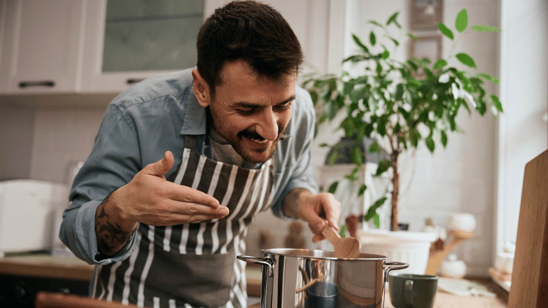 man cooking dinner while he's technically supposed to be working