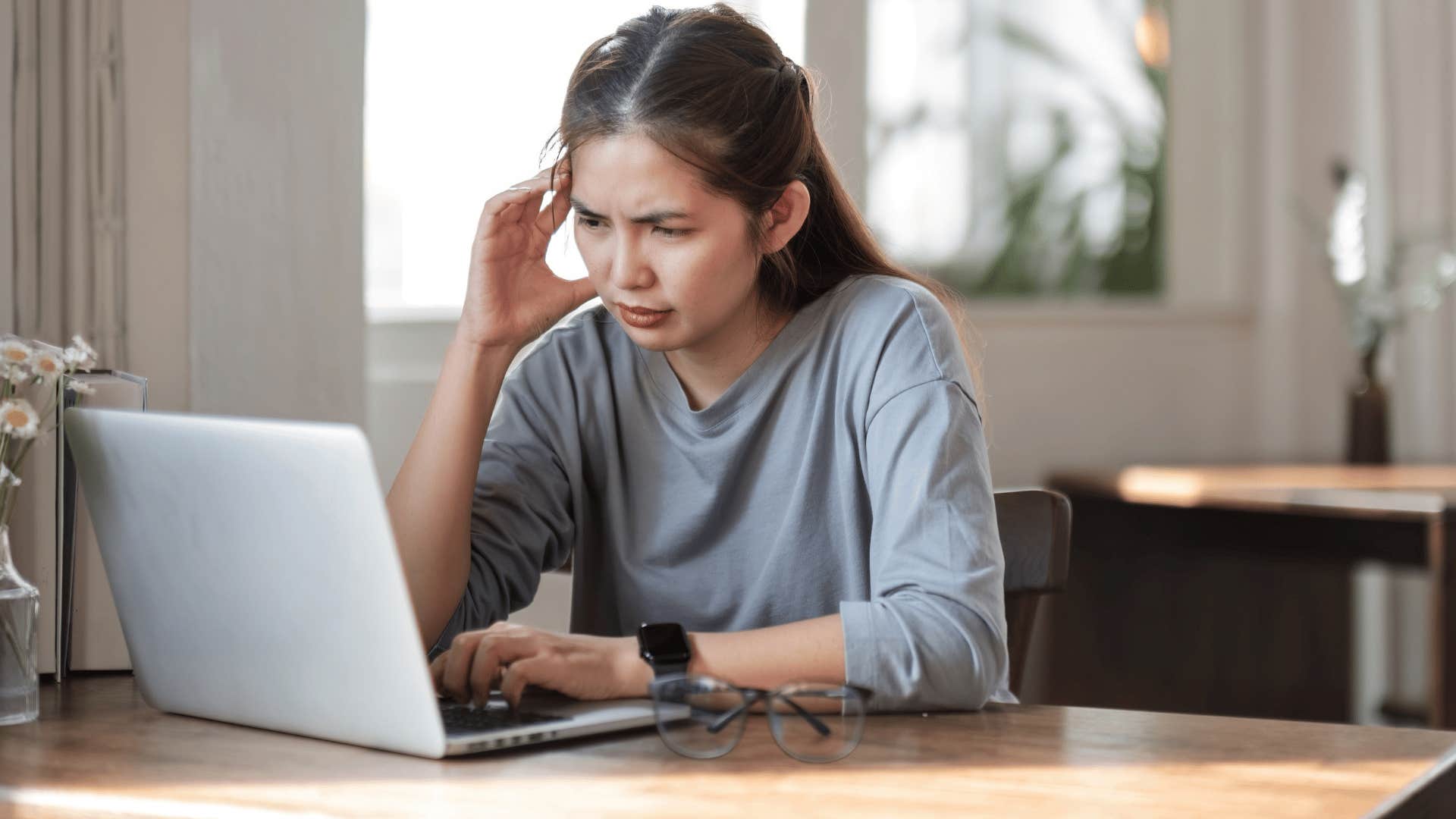 stressed woman on her laptop