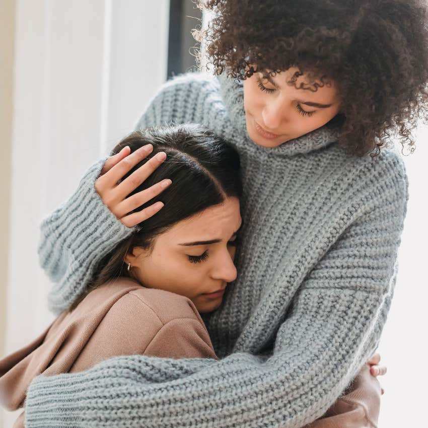 woman with a sixth sense understanding how her friend feels comforting her