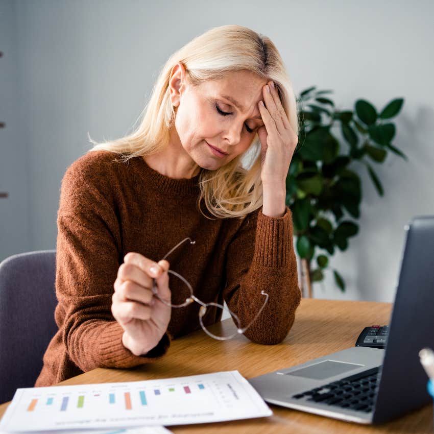 woman raised in the 70s feeling overwhelmed at work but too guilty to take time off