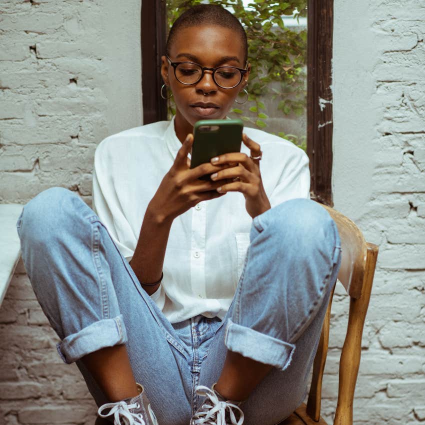 young woman texting having no problem saying no to an invitation
