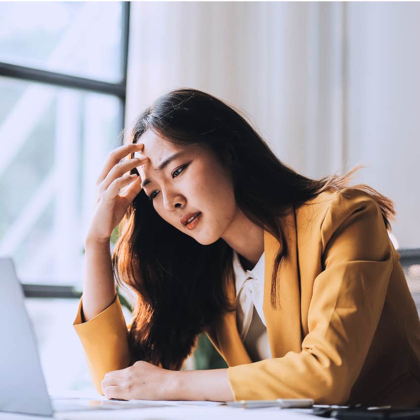 sad woman struggling to make decisions at work
