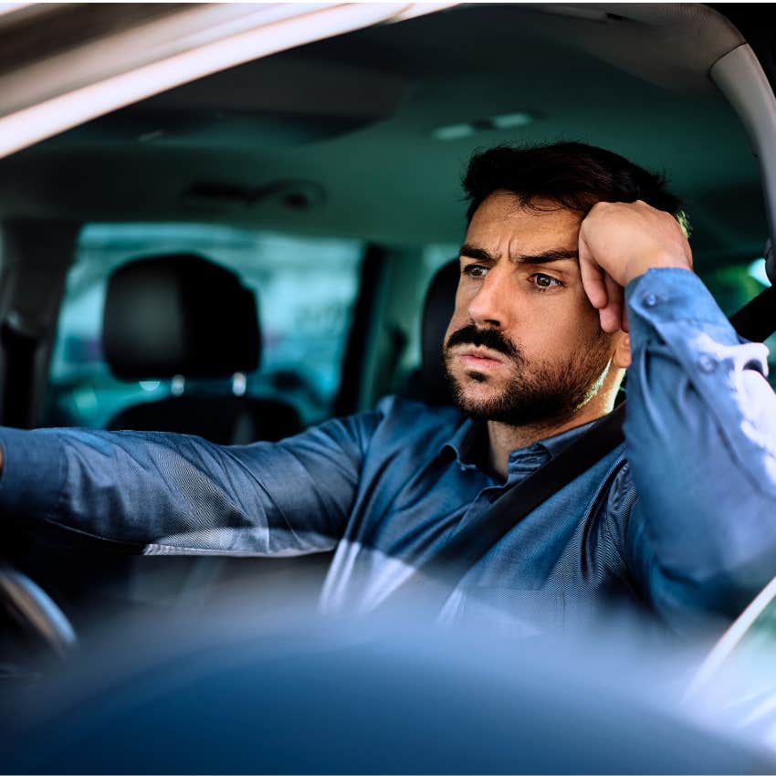 man driving his car trying to self-regulate by breathing