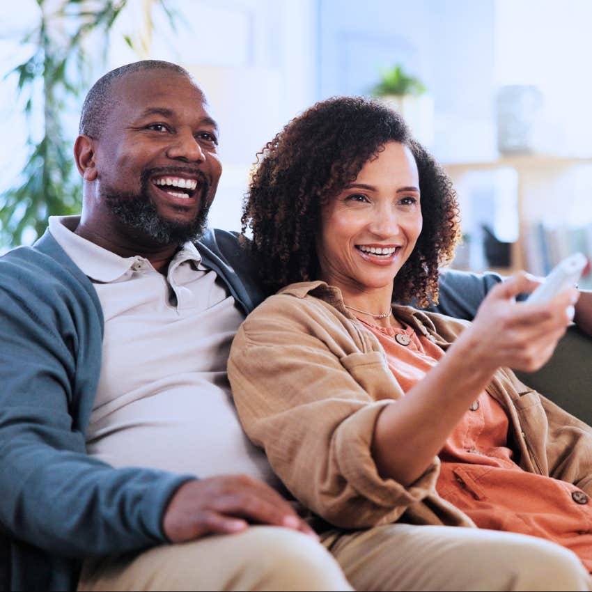 Gen X couple using cable TV at home.