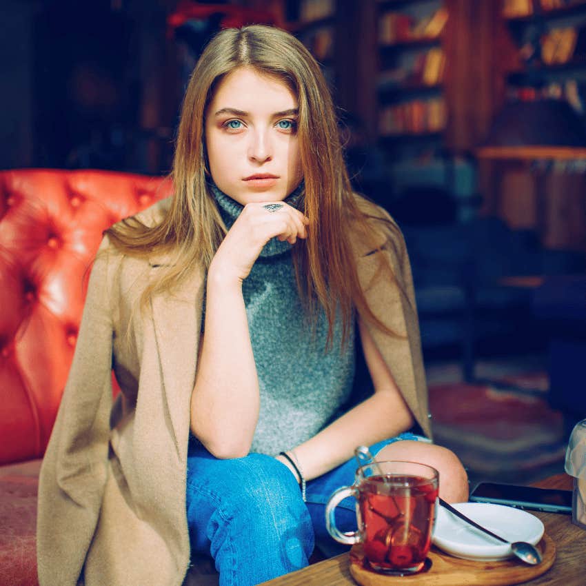 thoughtful serious woman sitting alone