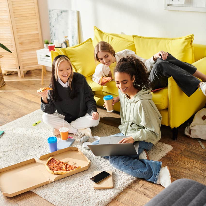 small group of friends eating pizza watching YouTube