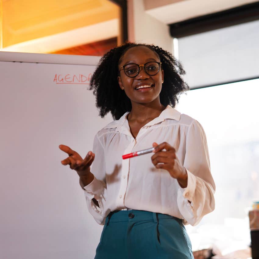 extroverted woman giving a presentation at work on the fly