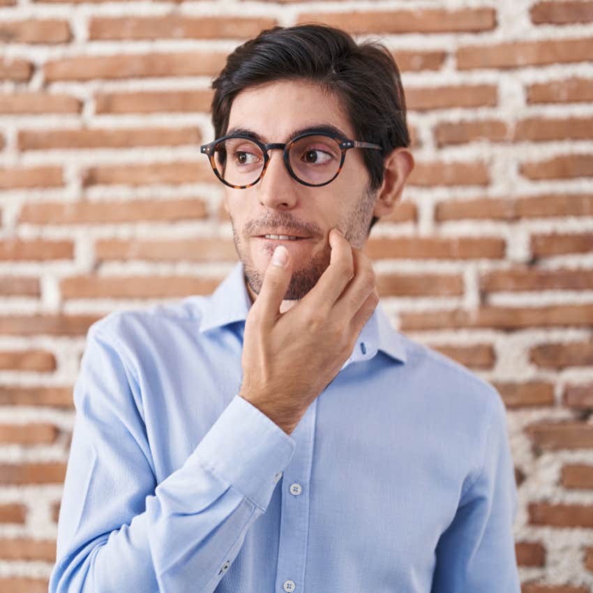 shy man looking awkward not enjoying attention