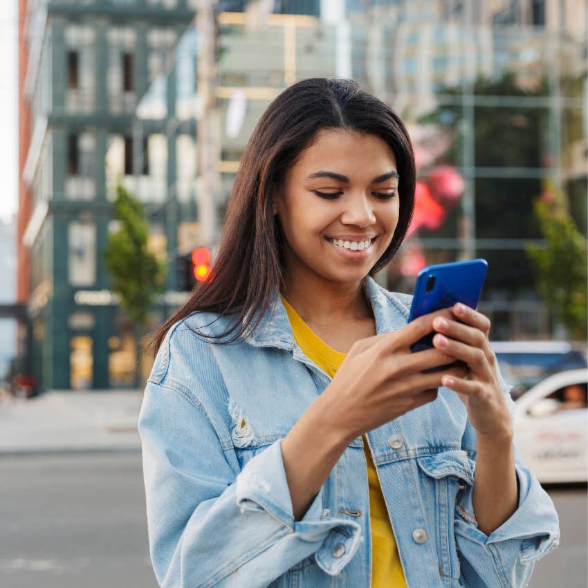 woman watching animal videos to boost her happiness