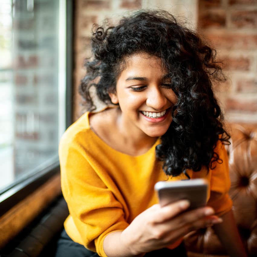 woman watching animal videos because it gives her more energy