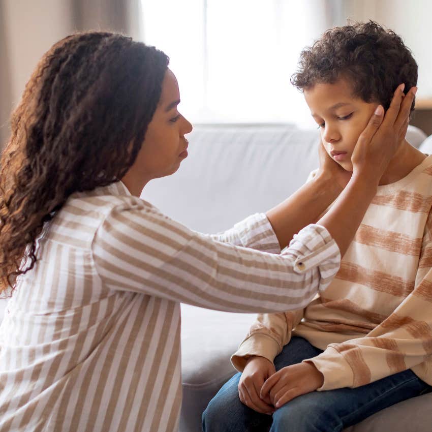 mom telling young boy ok be sad teaching emotional intelligence