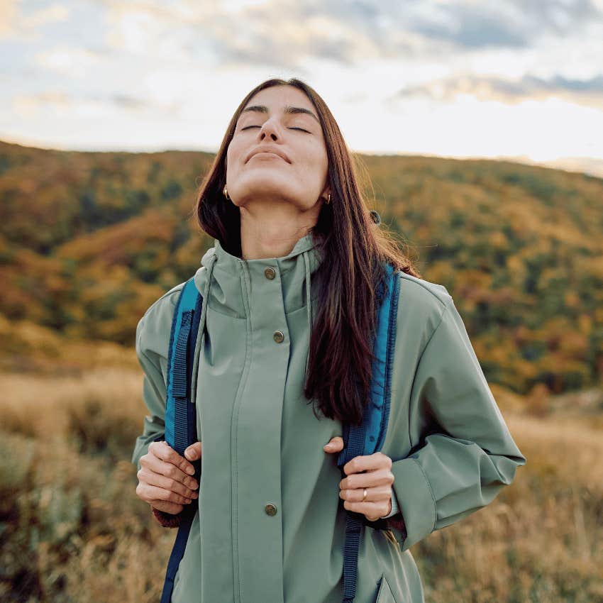 woman with high emotional resilience taking slow deep breaths