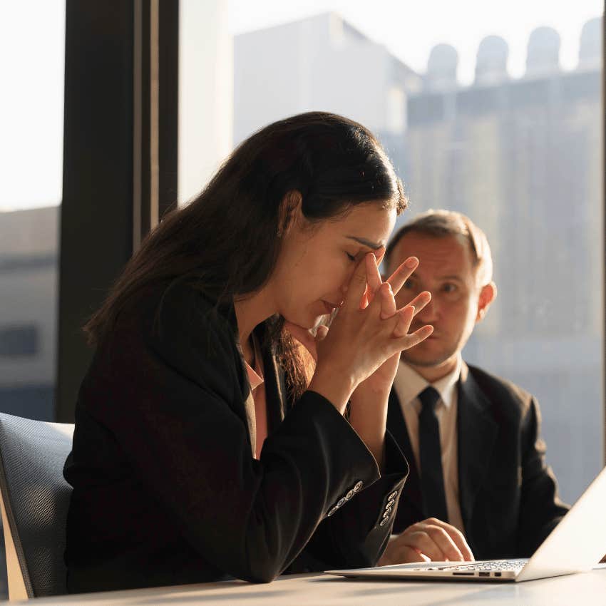woman in a meeting with a man learning how to concede