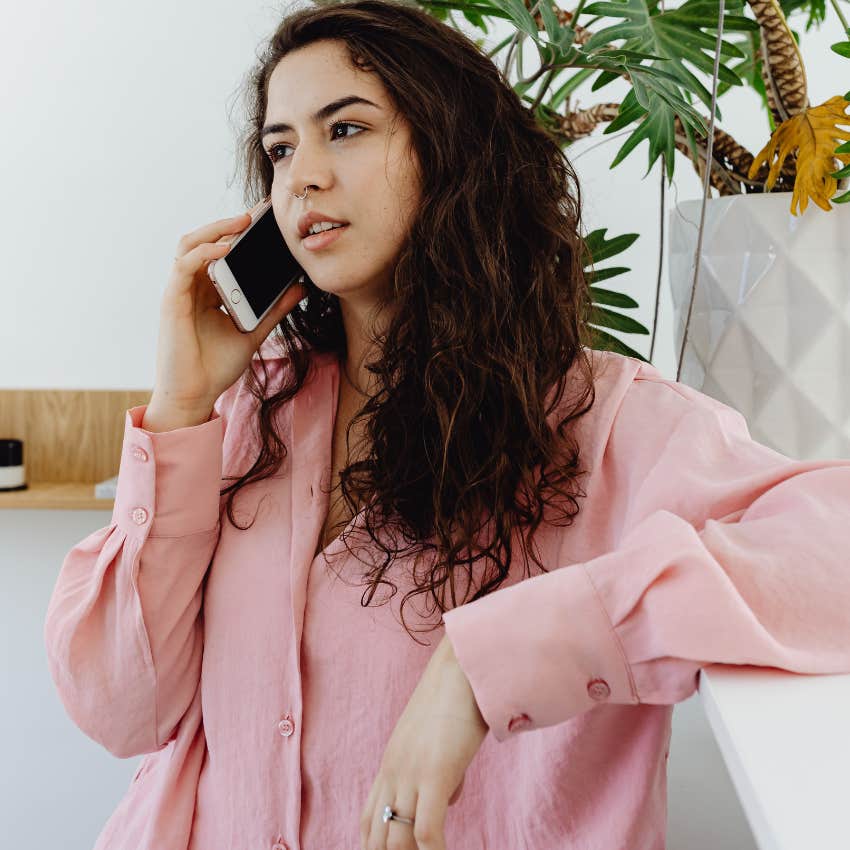woman being empathetic to her friend on the phone
