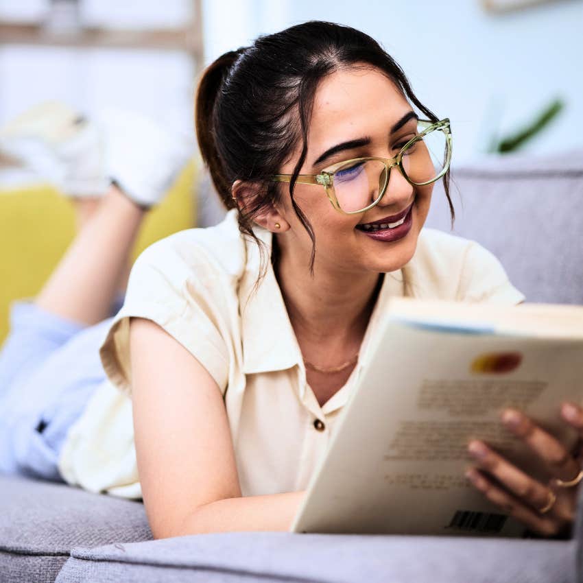 Gen Z woman taking time off work reading at home