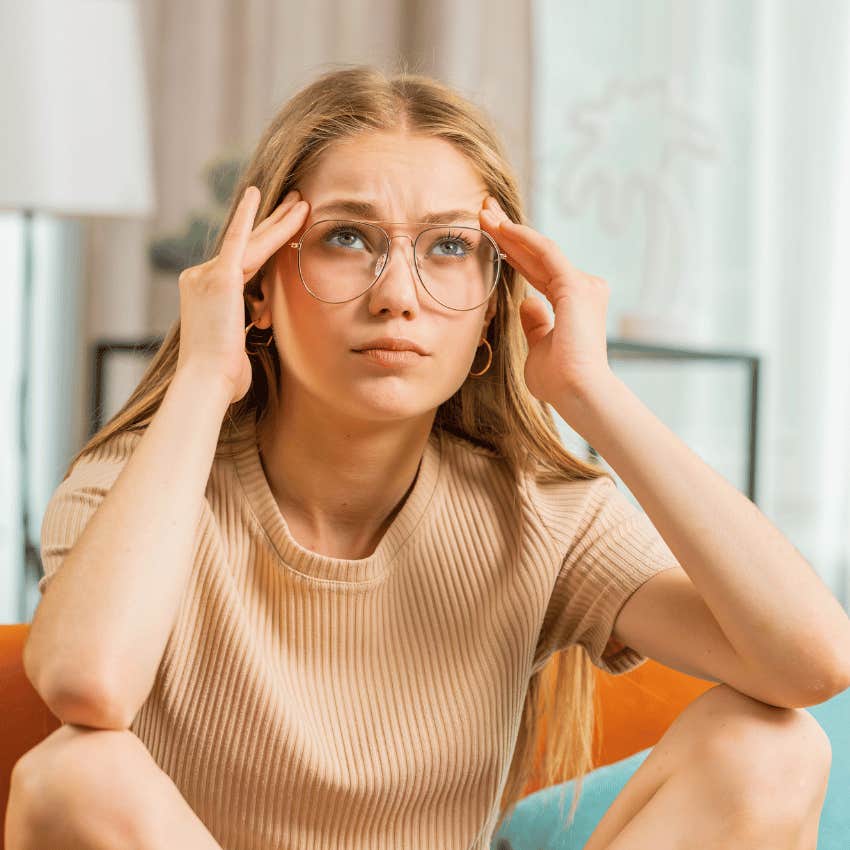 young woman struggling to stick to her goals because they're too outcome-based