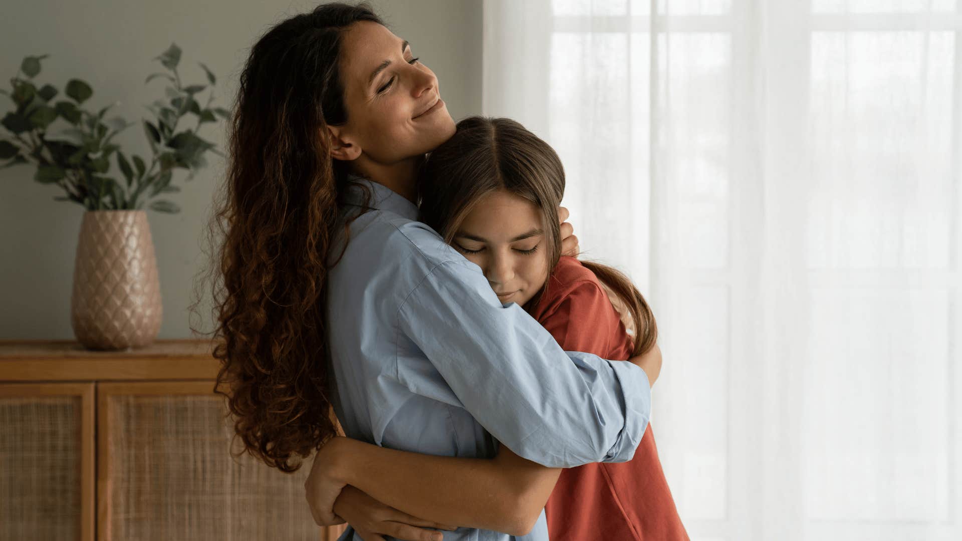 mother hugging daughter as she tells her i'll always be there to help you
