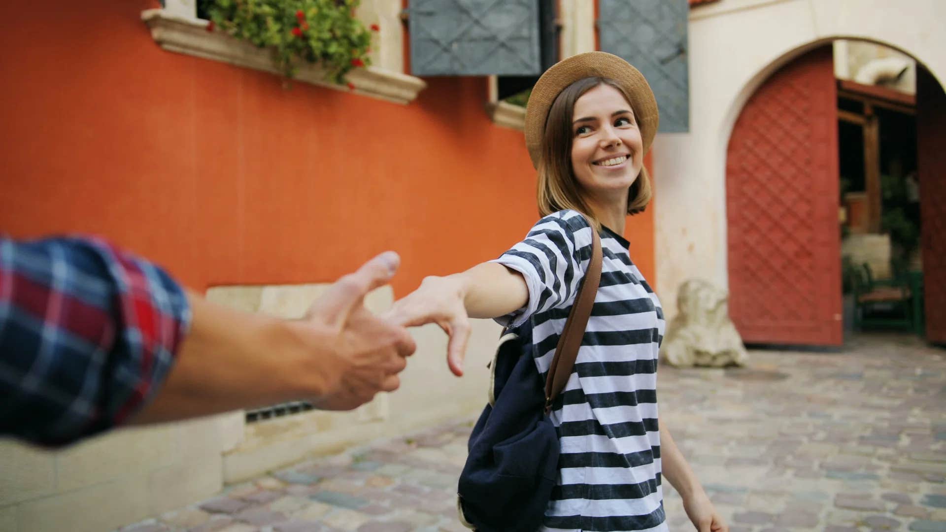 woman dragging man along exploring
