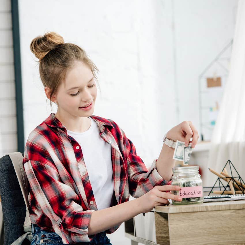 teen girl with a job in high school saving for college will become a money conscious adult