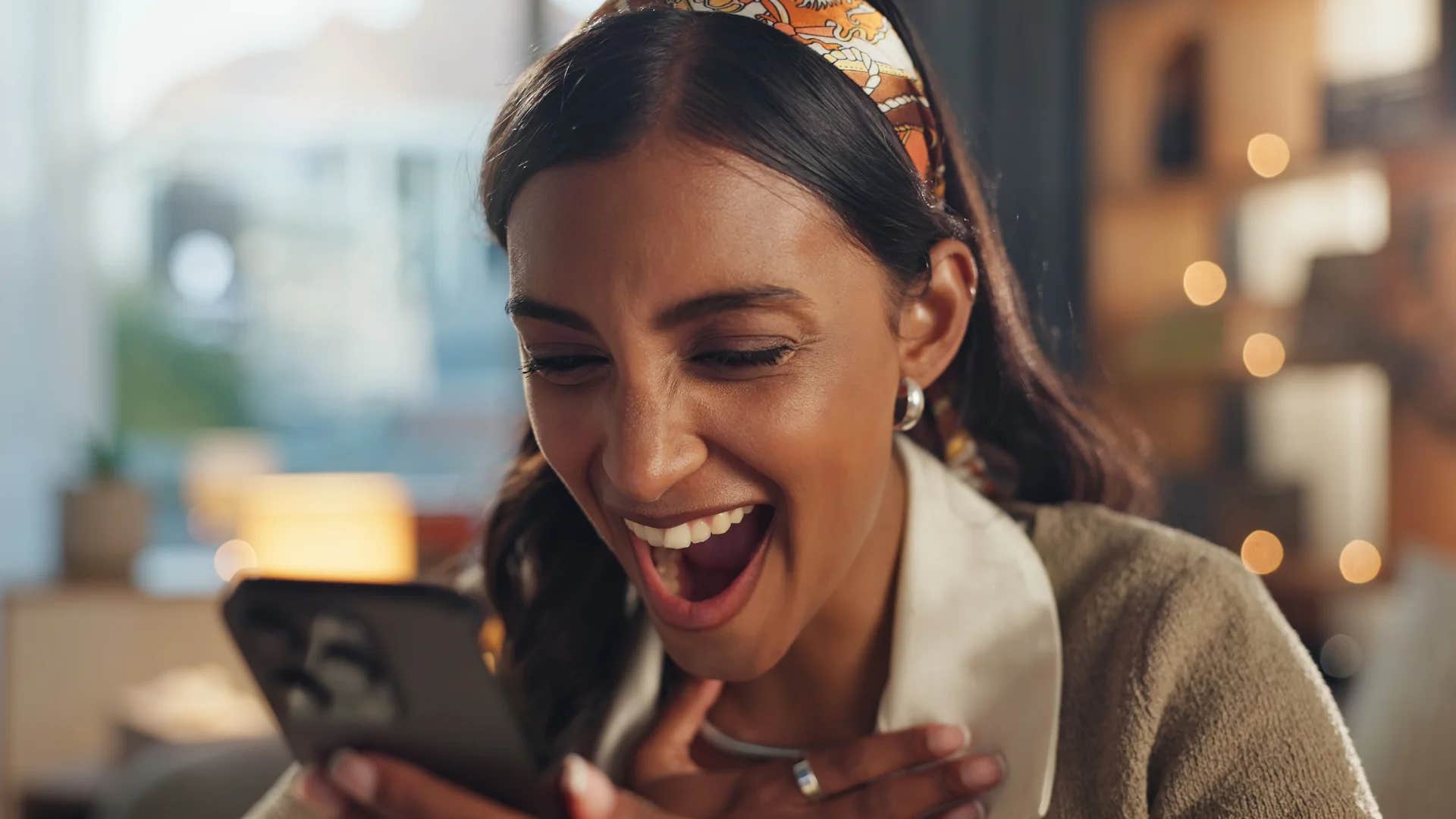 woman on phone texting spill the beans