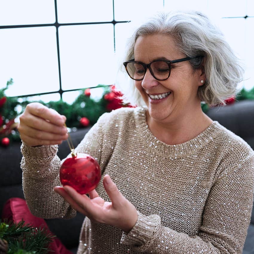 Gen X woman doing home decor in her house.