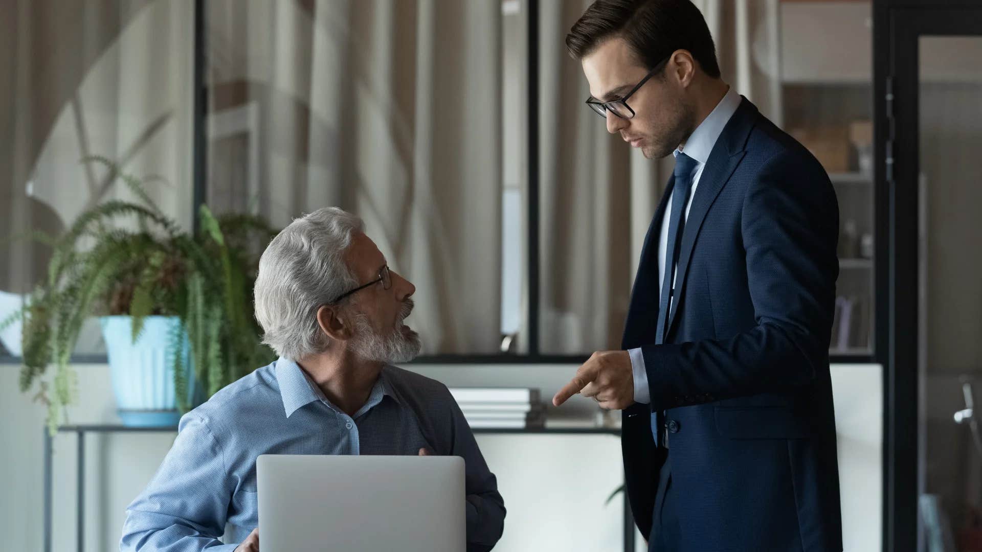 professional man telling older colleague that's not the way the world works anymore
