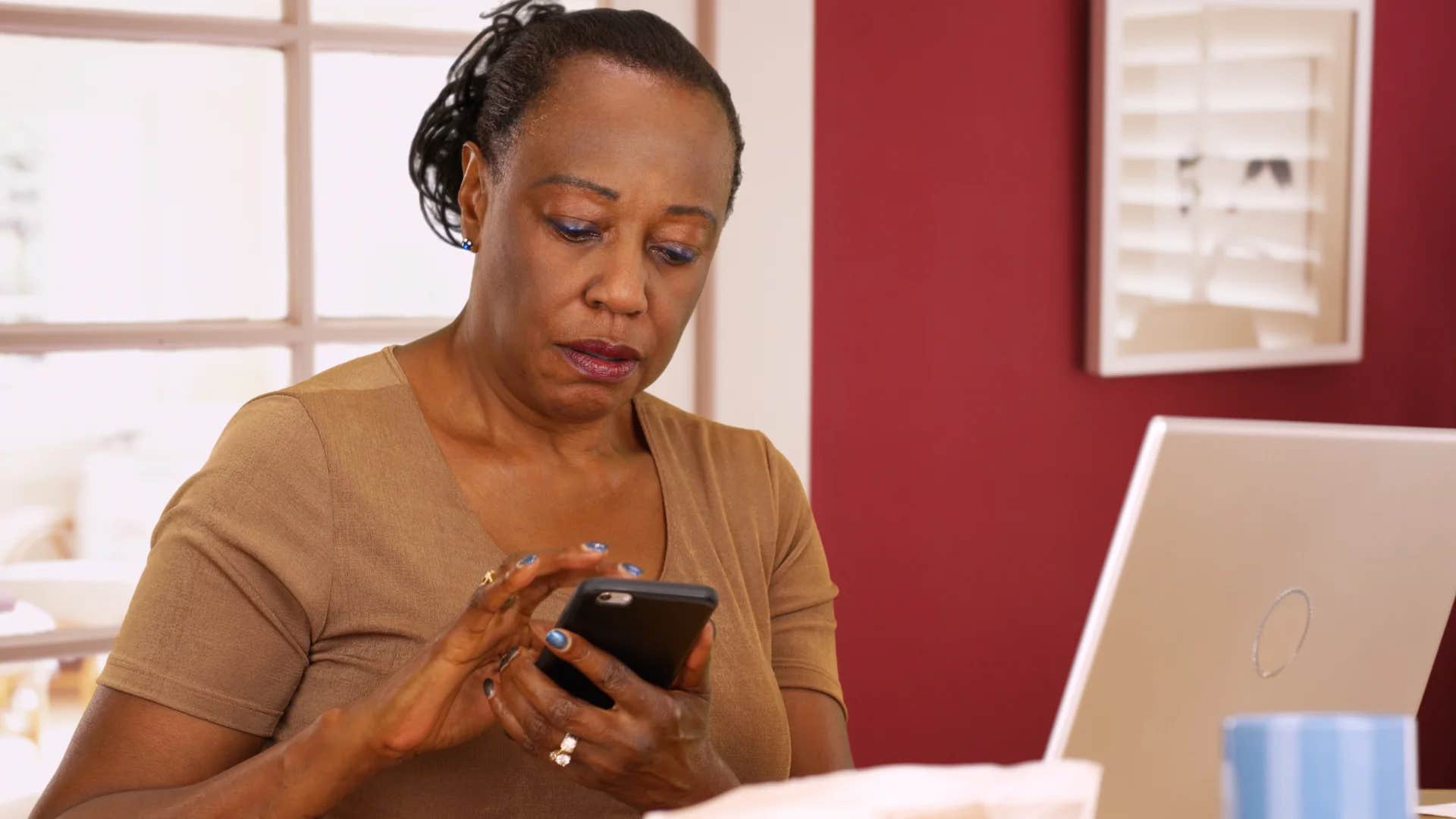 older woman reading message that says you're so old-fashioned