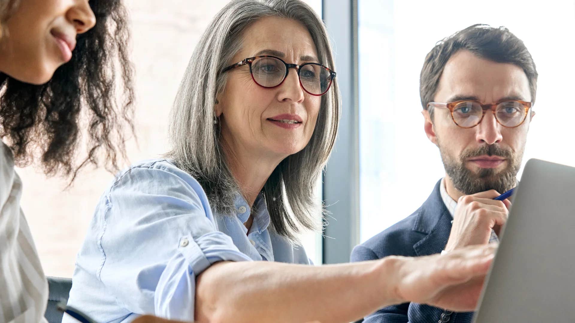 woman talking to colleagues let's try something else